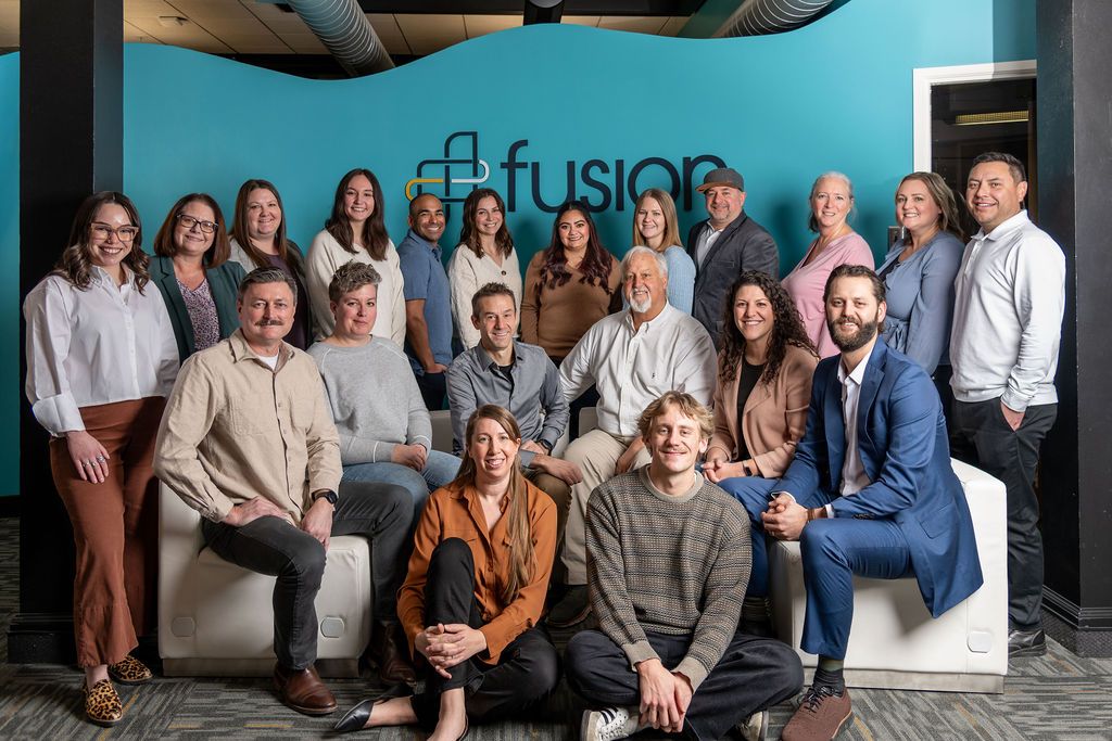 The Fusion team gathered together in the office